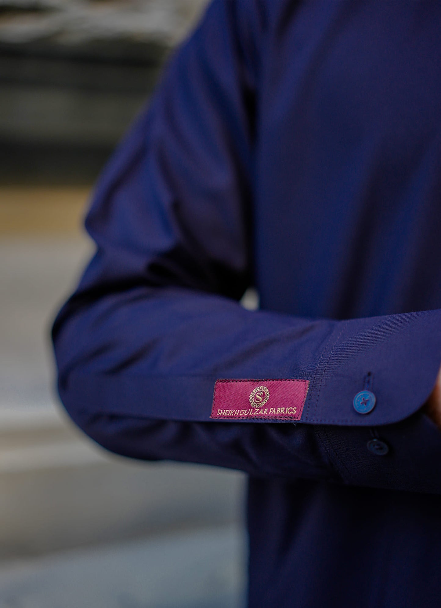 Sheikh Gulzar Fabrics Bosphorus Blue — close-up of sleeve detail with buttons, soft and durable premium unstitched fabric Pakistan.