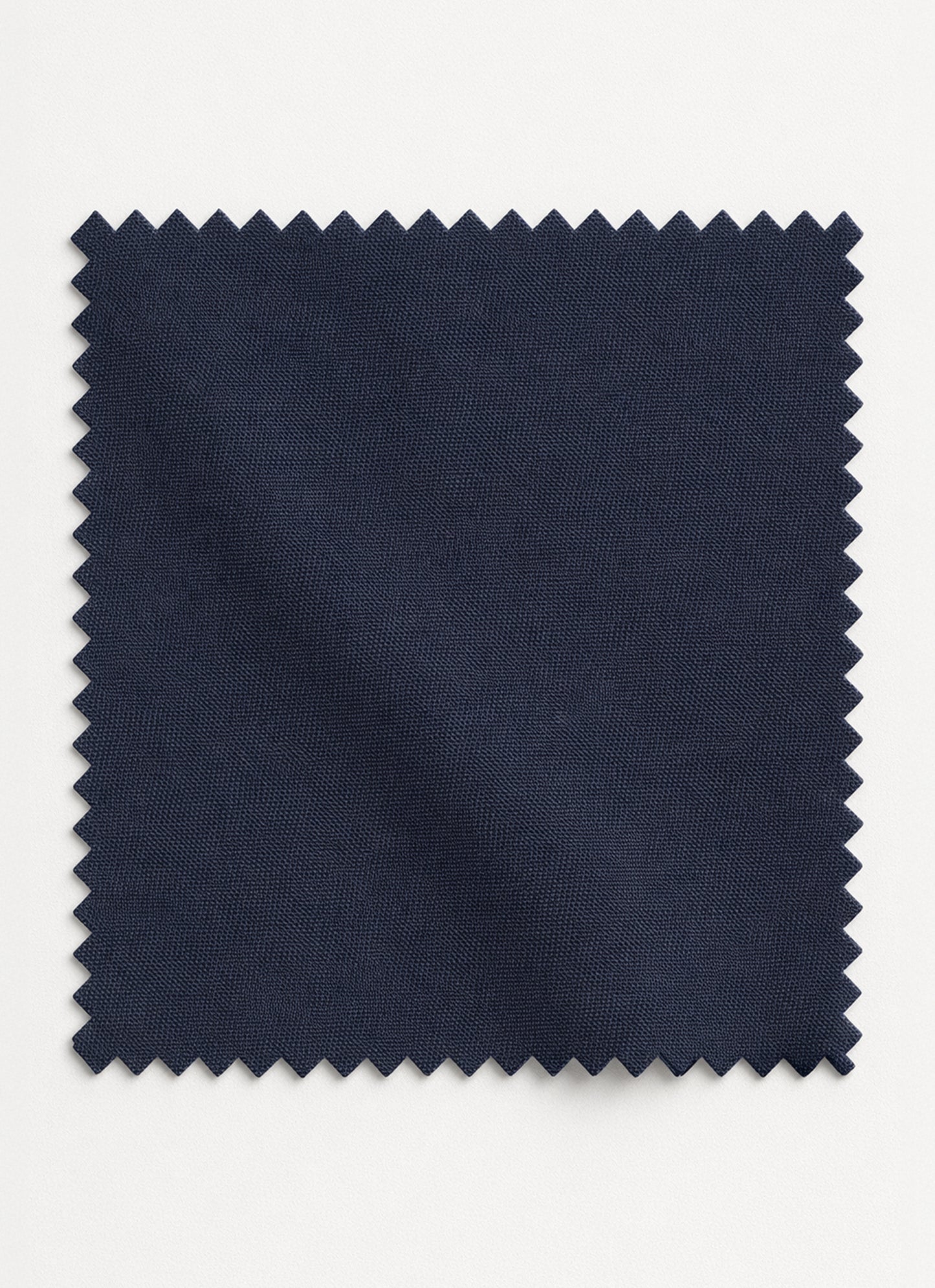 Close-up of charcoal grey unstitched shalwar kameez fabric showing its smoky tone