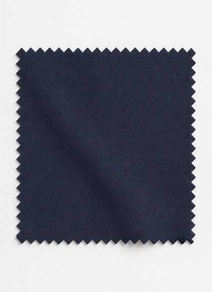 Close-up of charcoal grey unstitched shalwar kameez fabric showing its smoky tone