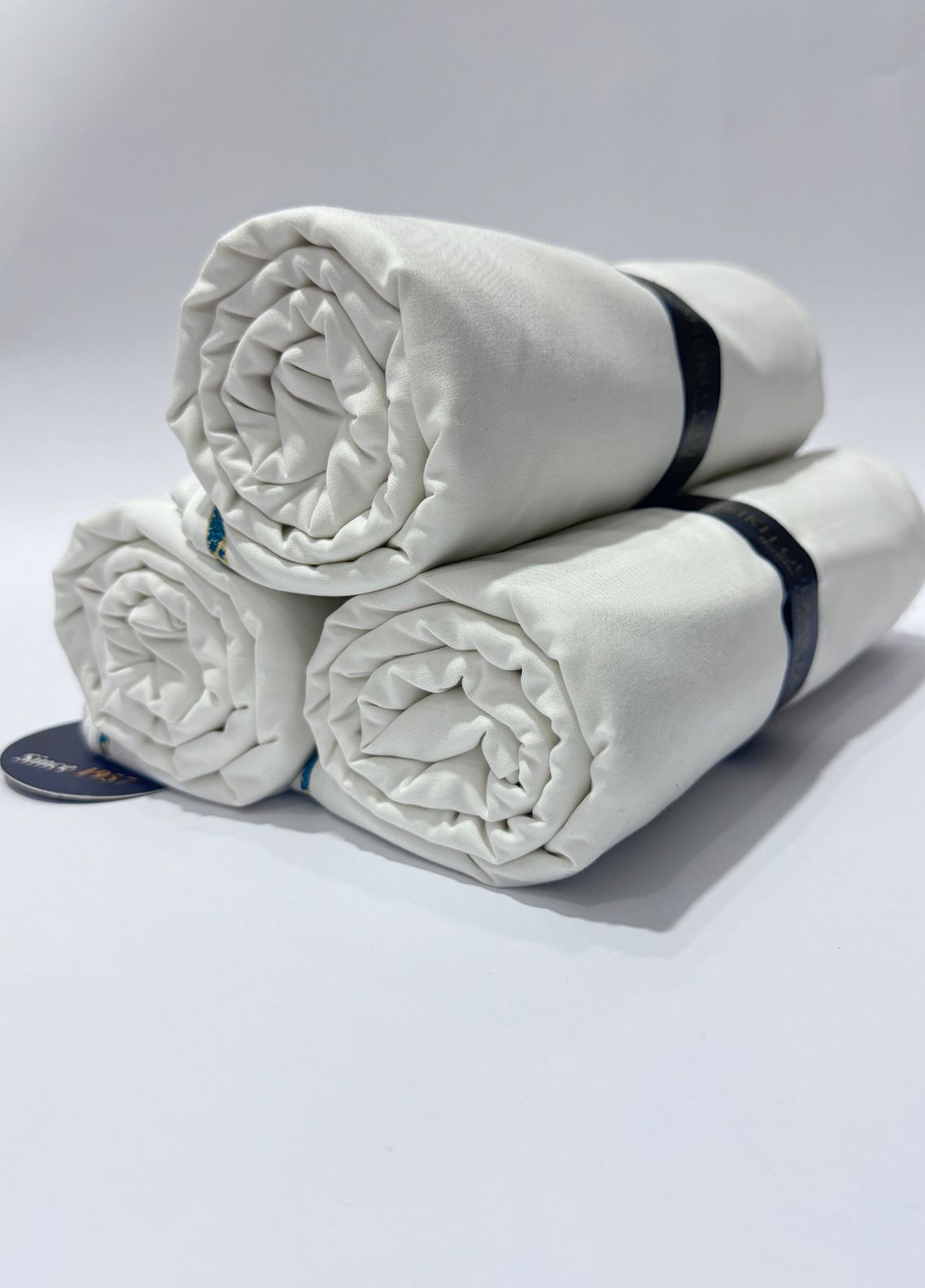 Rehmat 3-Suit Bundle by SGF — premium unstitched fabric rolls in grey and white, perfect for shalwar kameez tailoring, Ramadan fabric offer Pakistan.