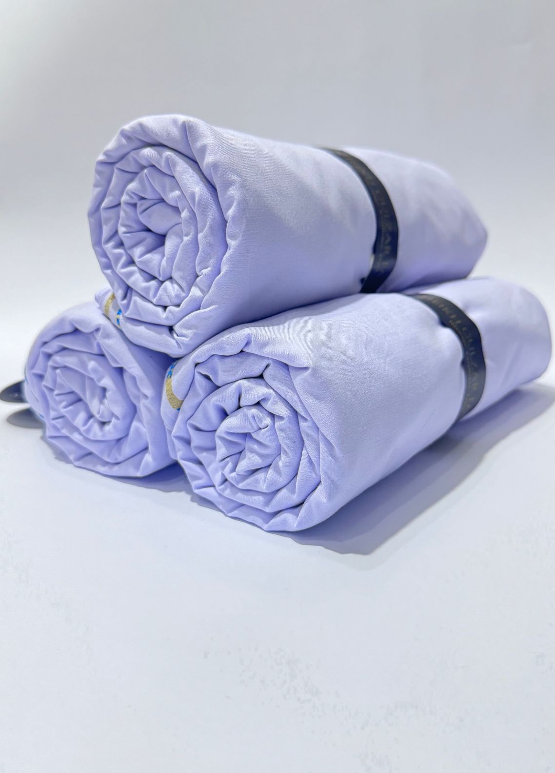 Sheikh Gulzar Fabrics Rehmat Trio — fabric bundle with premium purple and white unstitched fabric, Ramadan special men’s fabric offer Pakistan.
