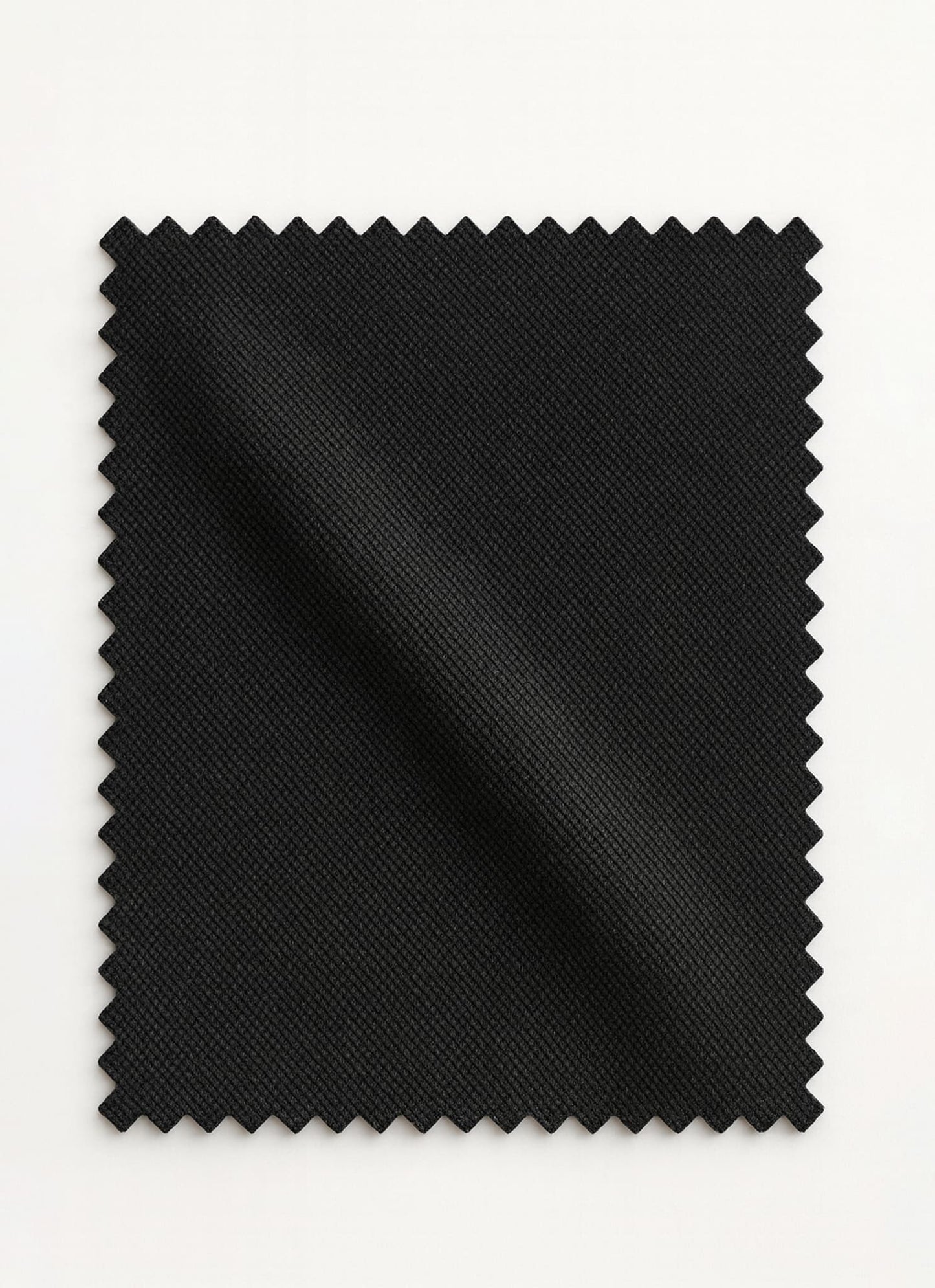 Viven Black Edition by SGF — close-up swatch of deep black premium self-check wrinkle-free fabric, luxury men’s shalwar kameez fabric Pakistan.