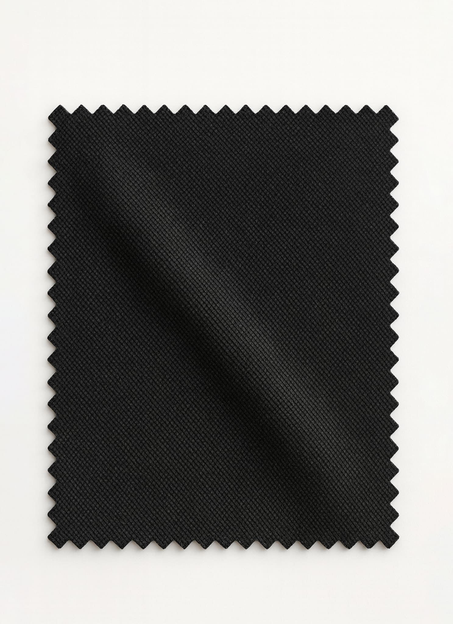 Viven Black Edition by SGF — close-up swatch of deep black premium self-check wrinkle-free fabric, luxury men’s shalwar kameez fabric Pakistan.