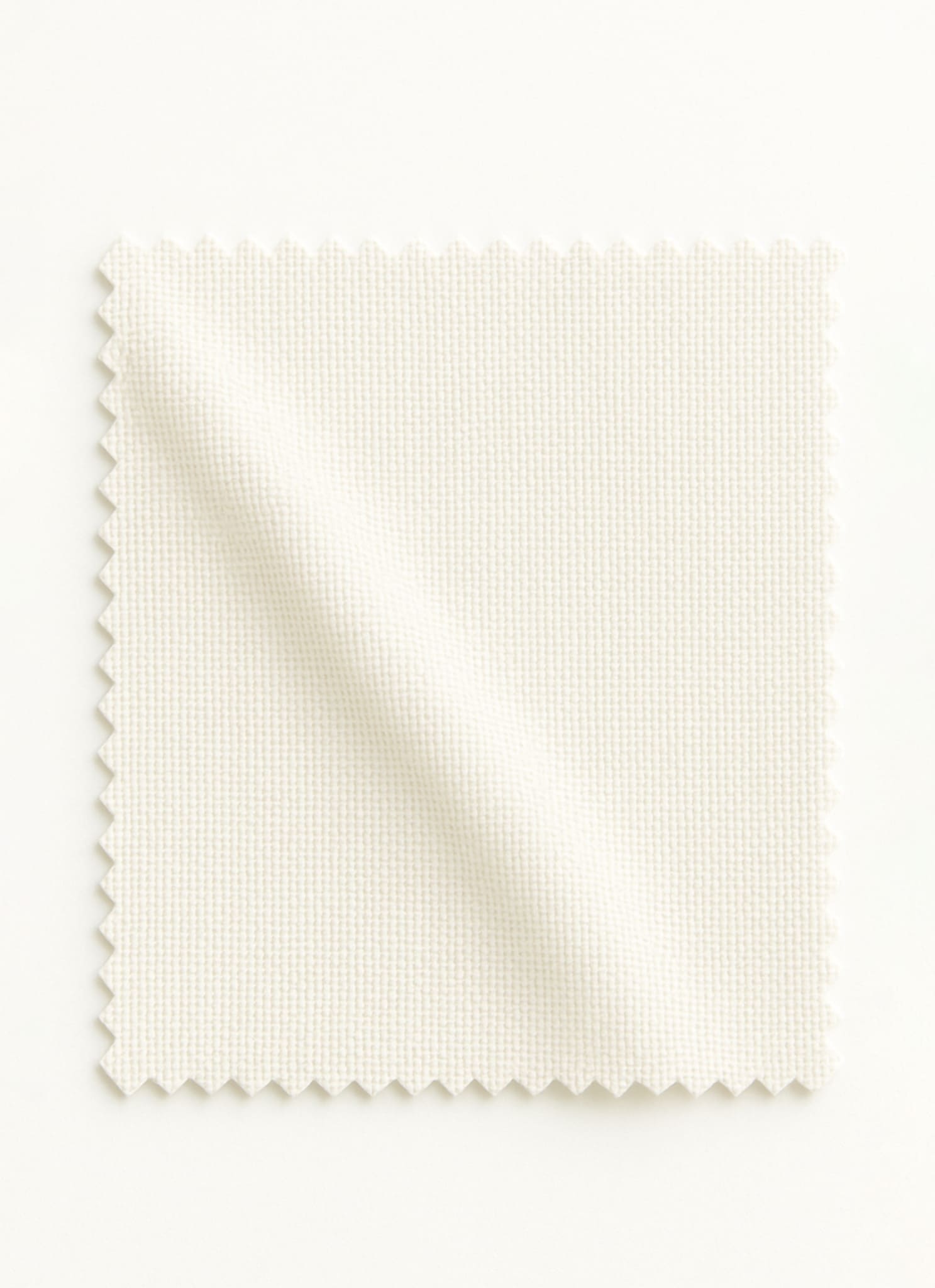 White fabric swatch on a offwhite background