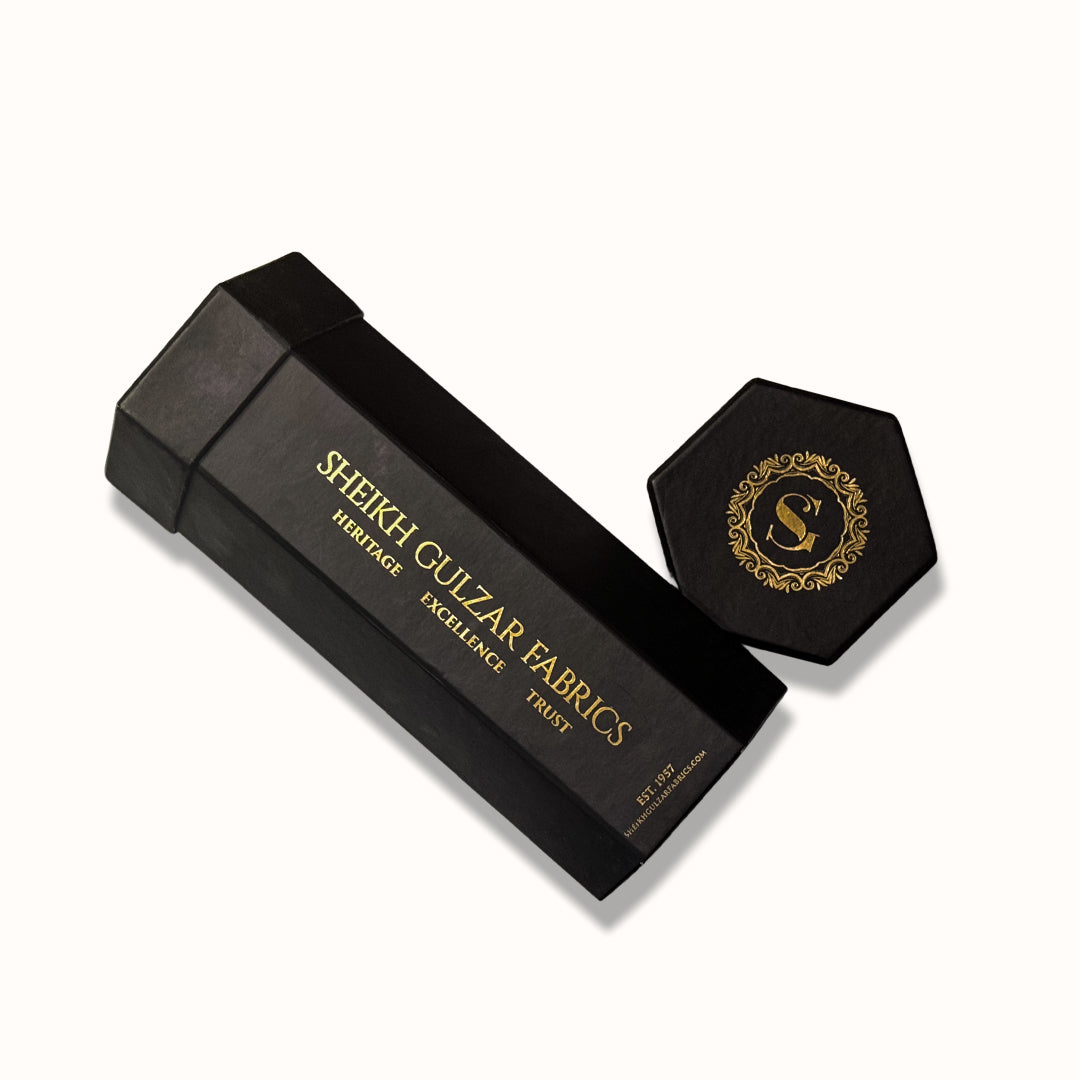 Sheikh Gulzar Fabrics X Black — premium black unstitched fabric with luxury SGF signature packaging, high-quality men’s shalwar kameez fabric Pakistan.